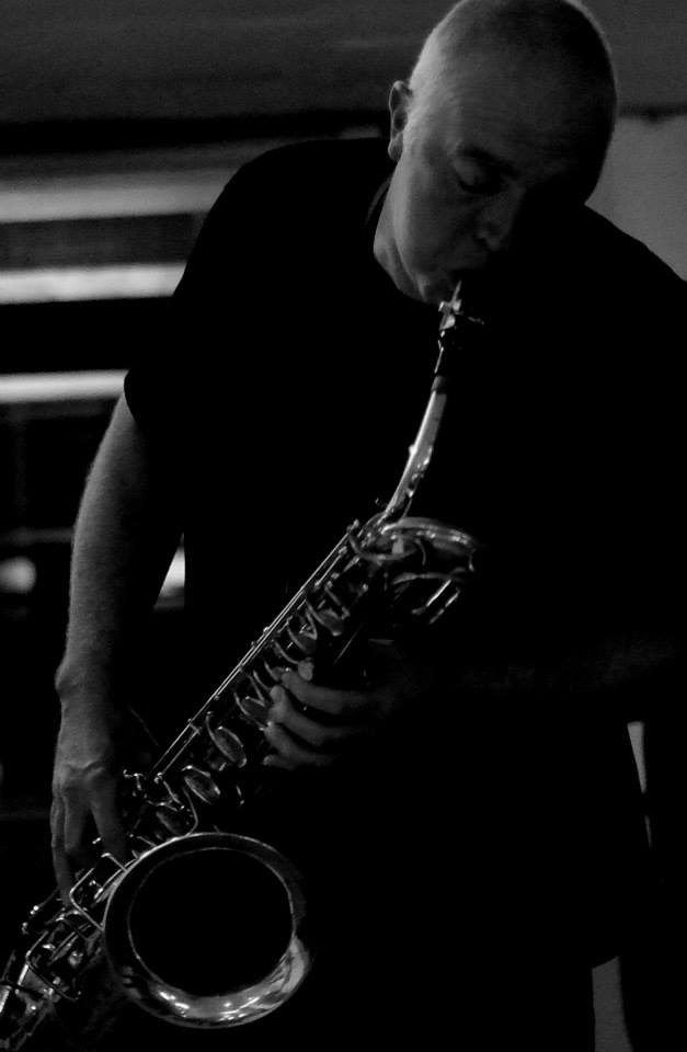 John Grieve playing baritone saxophone